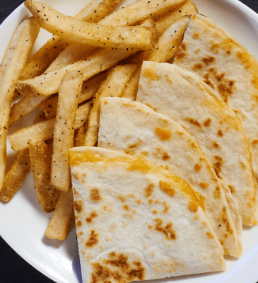 a plate of cheese quesadilla for kids with friends